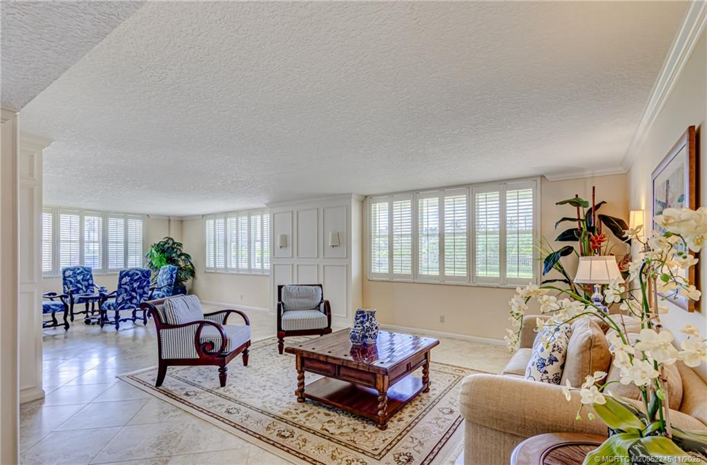 500 Ocean Drive, Unit W11 North Palm Beach, FL 33408 - Photo 54 of 77 a living room with furniture and a window