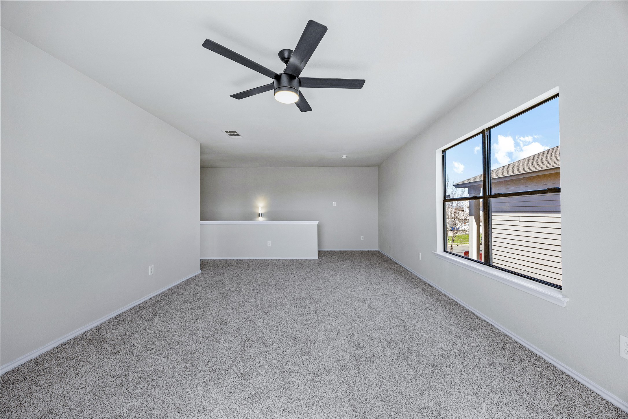 7541 Redrick Drive Austin, TX 78747 - Photo 27 of 40 Carpeted empty room with visible vents, a ceiling fan, and baseboards