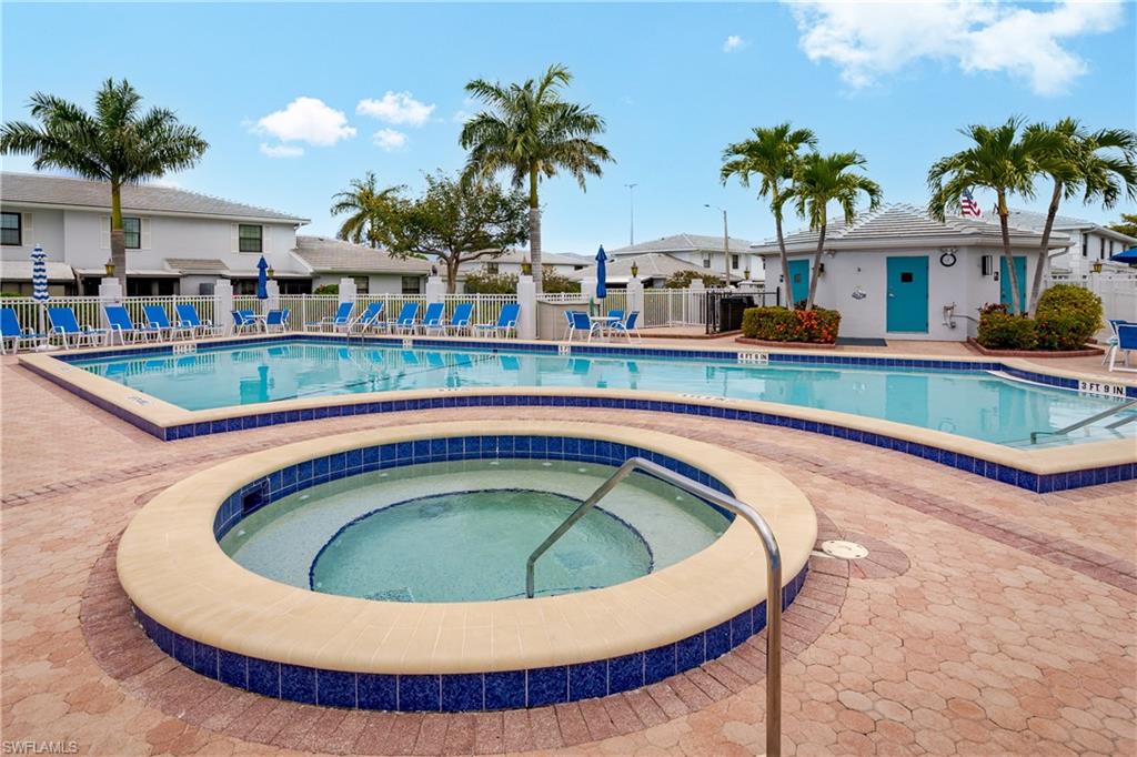 116 Clyburn Street, Unit C6 Marco Island, FL 34145 - Photo 1 of 32 a view of swimming pool with outdoor seating and yard