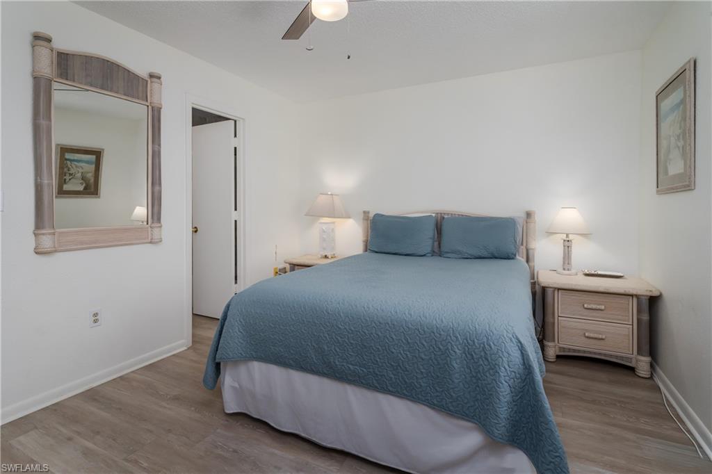 116 Clyburn Street, Unit C6 Marco Island, FL 34145 - Photo 15 of 32 a bedroom with a bed and a cabinets