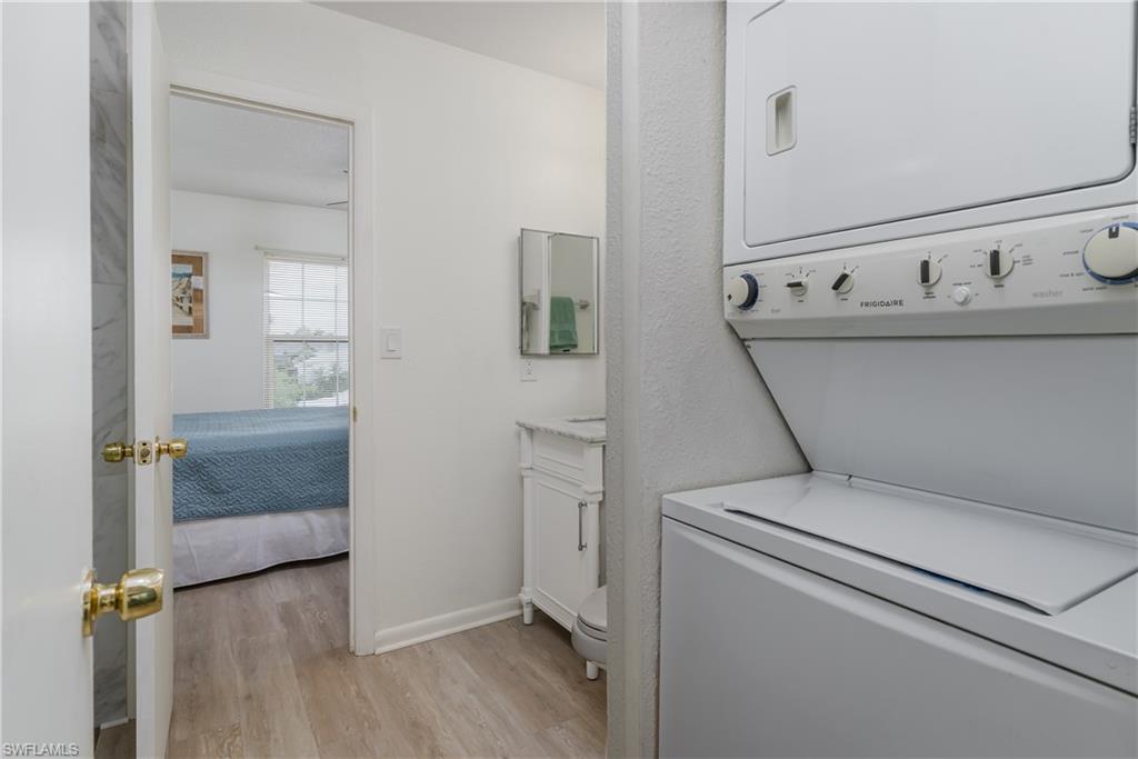 116 Clyburn Street, Unit C6 Marco Island, FL 34145 - Photo 19 of 32 a utility room with dryer and washer