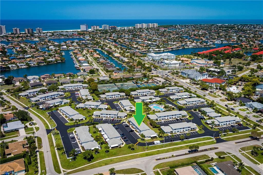 116 Clyburn Street, Unit C6 Marco Island, FL 34145 - Photo 2 of 32 an aerial view of residential houses with outdoor space