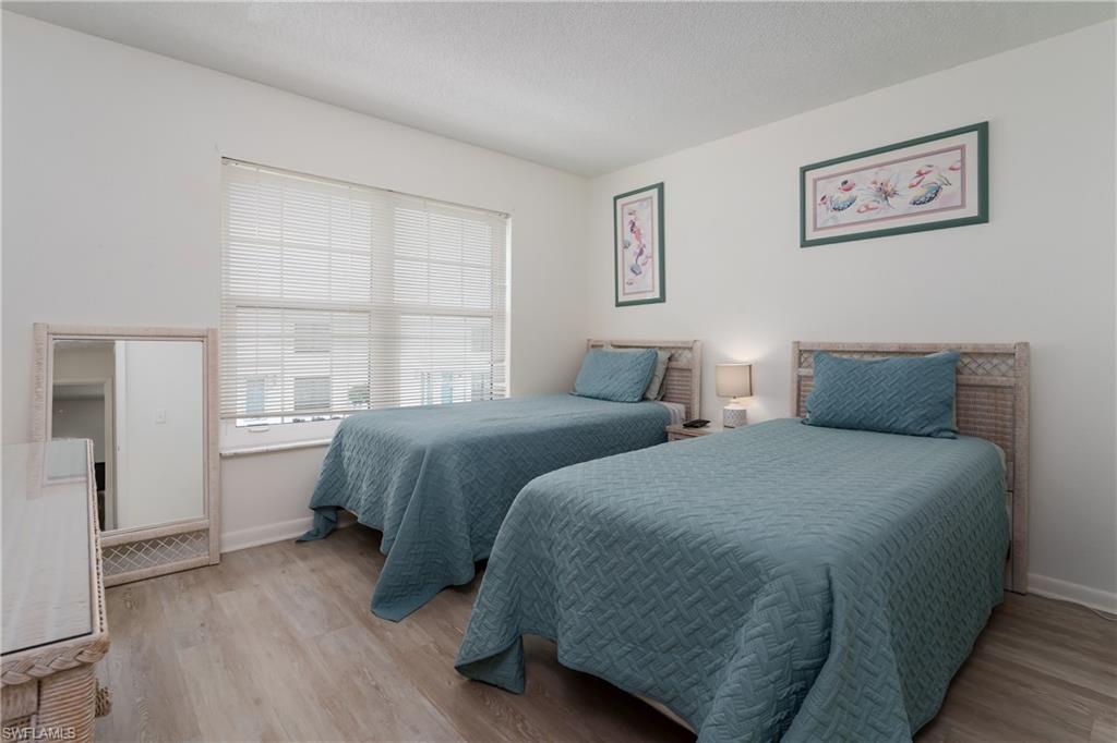 116 Clyburn Street, Unit C6 Marco Island, FL 34145 - Photo 21 of 32 a bedroom with two beds and a window