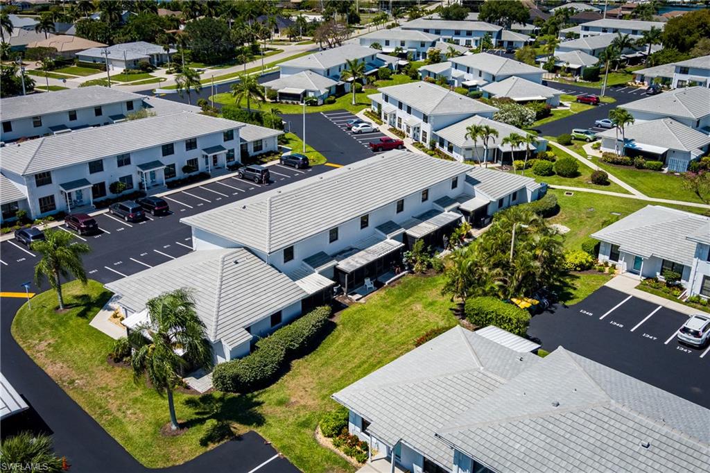 116 Clyburn Street, Unit C6 Marco Island, FL 34145 - Photo 26 of 32 an aerial view of a house with a garden