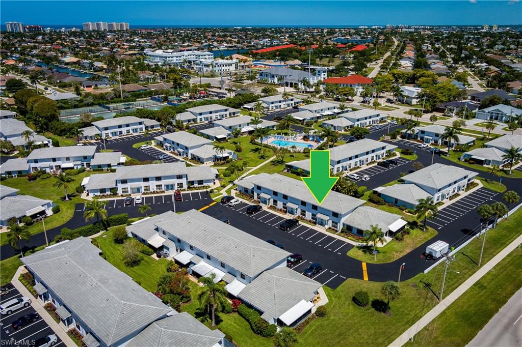 116 Clyburn Street, Unit C6 Marco Island, FL 34145 - Photo 27 of 32 an aerial view of a house with a garden