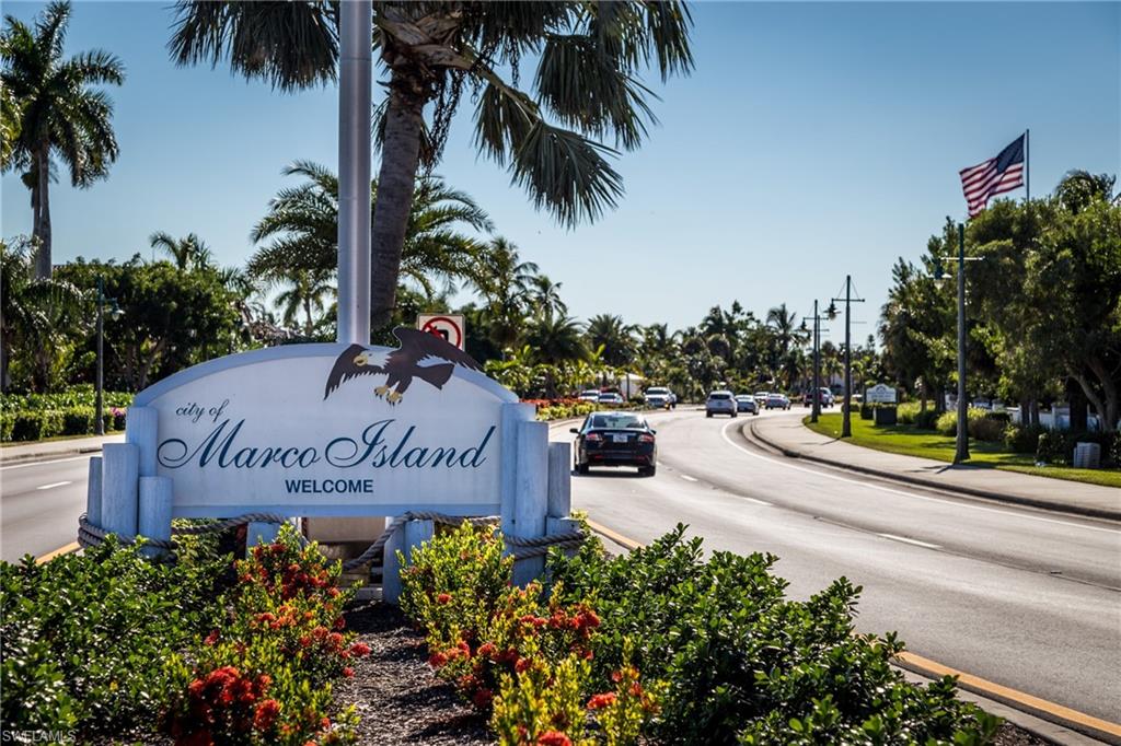 116 Clyburn Street, Unit C6 Marco Island, FL 34145 - Photo 29 of 32 a view of a park with palm trees