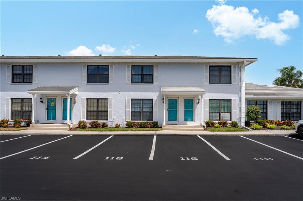 116 Clyburn Street, Unit C6 Marco Island, FL 34145 - Photo 3 of 32 a front view of a building with street view