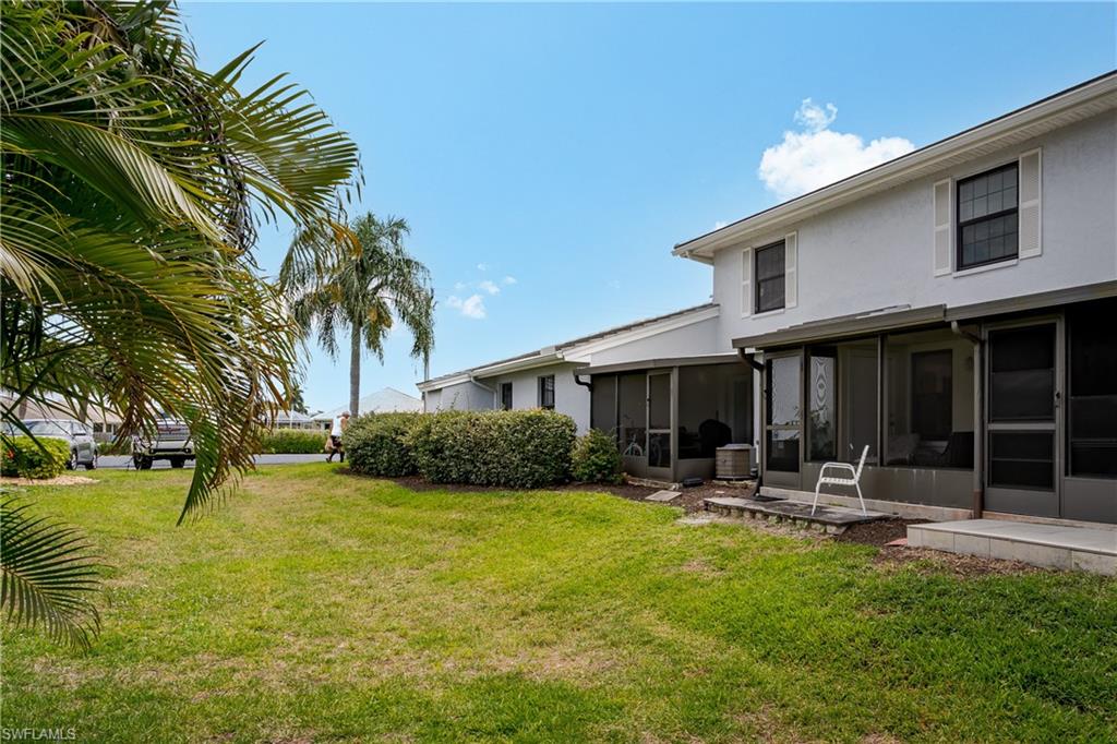 116 Clyburn Street, Unit C6 Marco Island, FL 34145 - Photo 4 of 32 a view of a house with swimming pool and sitting area