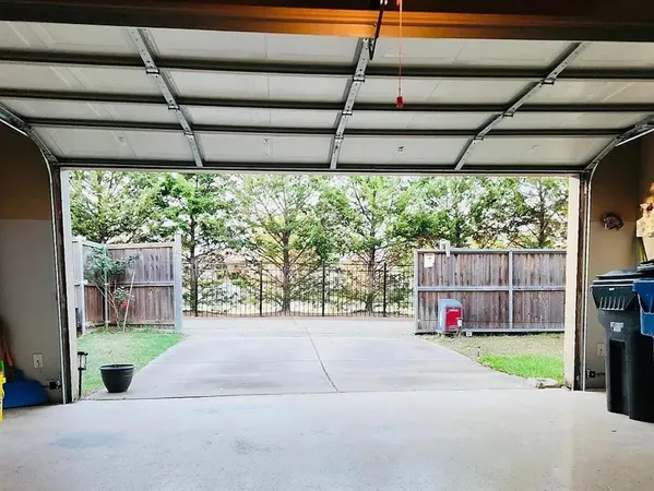 a view of a backyard with door and porch
