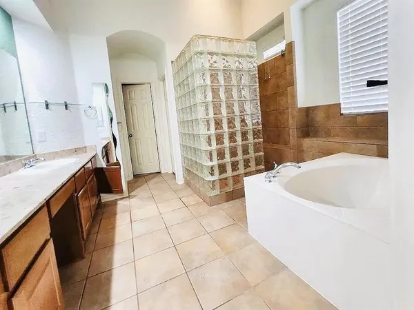 a bathroom with a bathtub sink and toilet