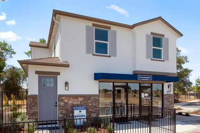 a front view of a house with glass windows