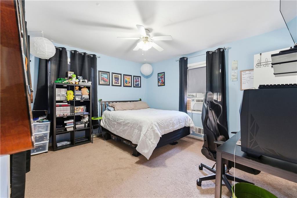3033 Thrasher Circle Decatur, GA 30032 - Photo 13 of 25 a bedroom with a bed tv and a window