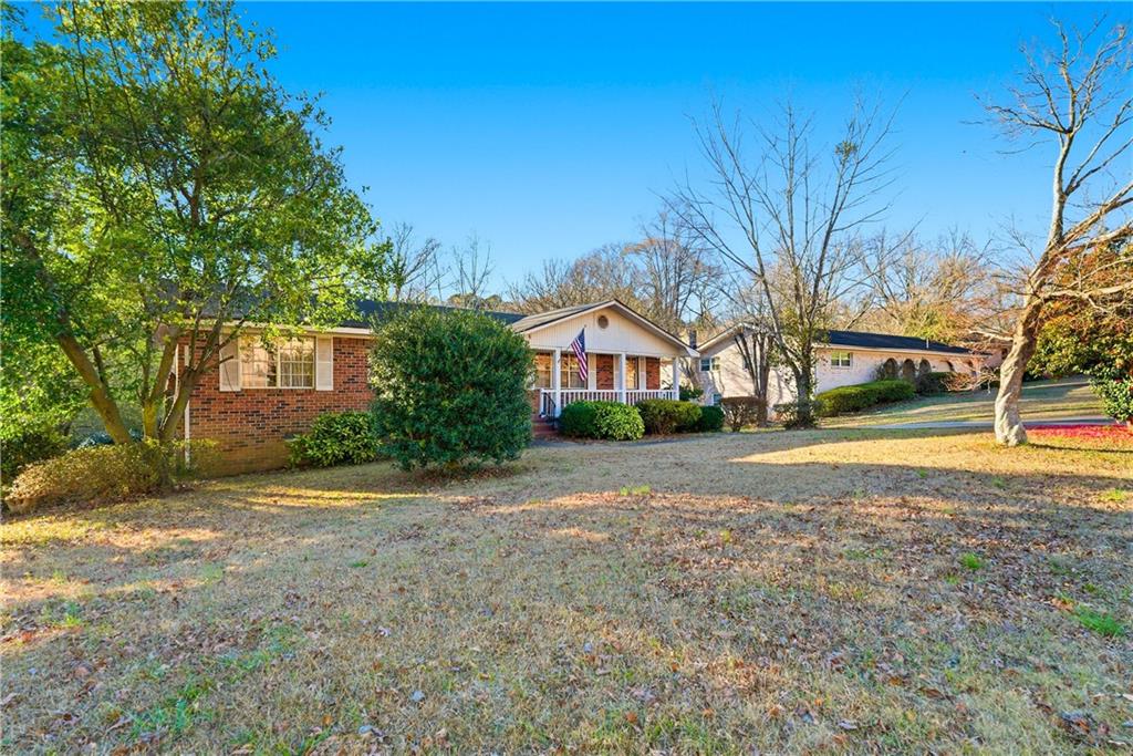 3033 Thrasher Circle Decatur, GA 30032 - Photo 3 of 25 a front view of a house with a yard