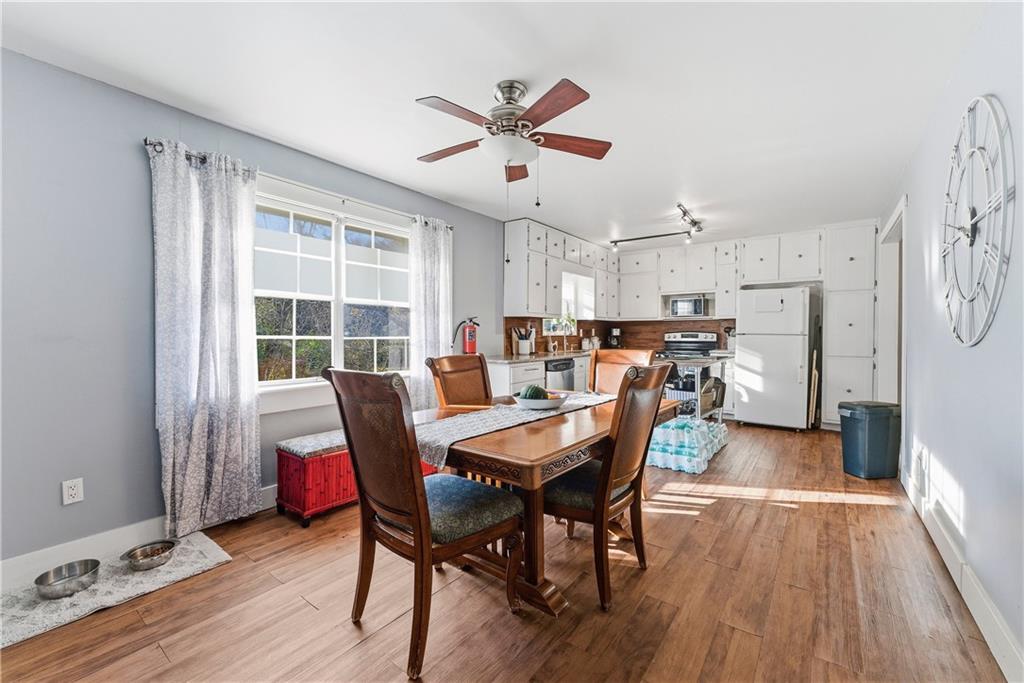 3033 Thrasher Circle Decatur, GA 30032 - Photo 7 of 25 a dining room with furniture and wooden floor