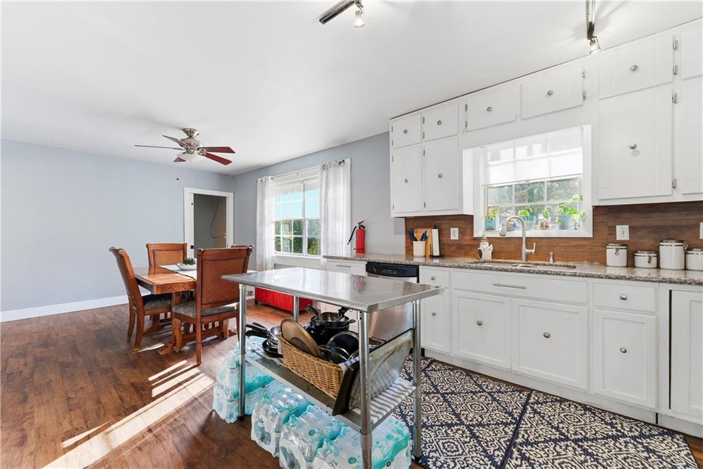 3033 Thrasher Circle Decatur, GA 30032 - Photo 9 of 25 a kitchen with stainless steel appliances granite countertop a stove a sink dishwasher and a refrigerator