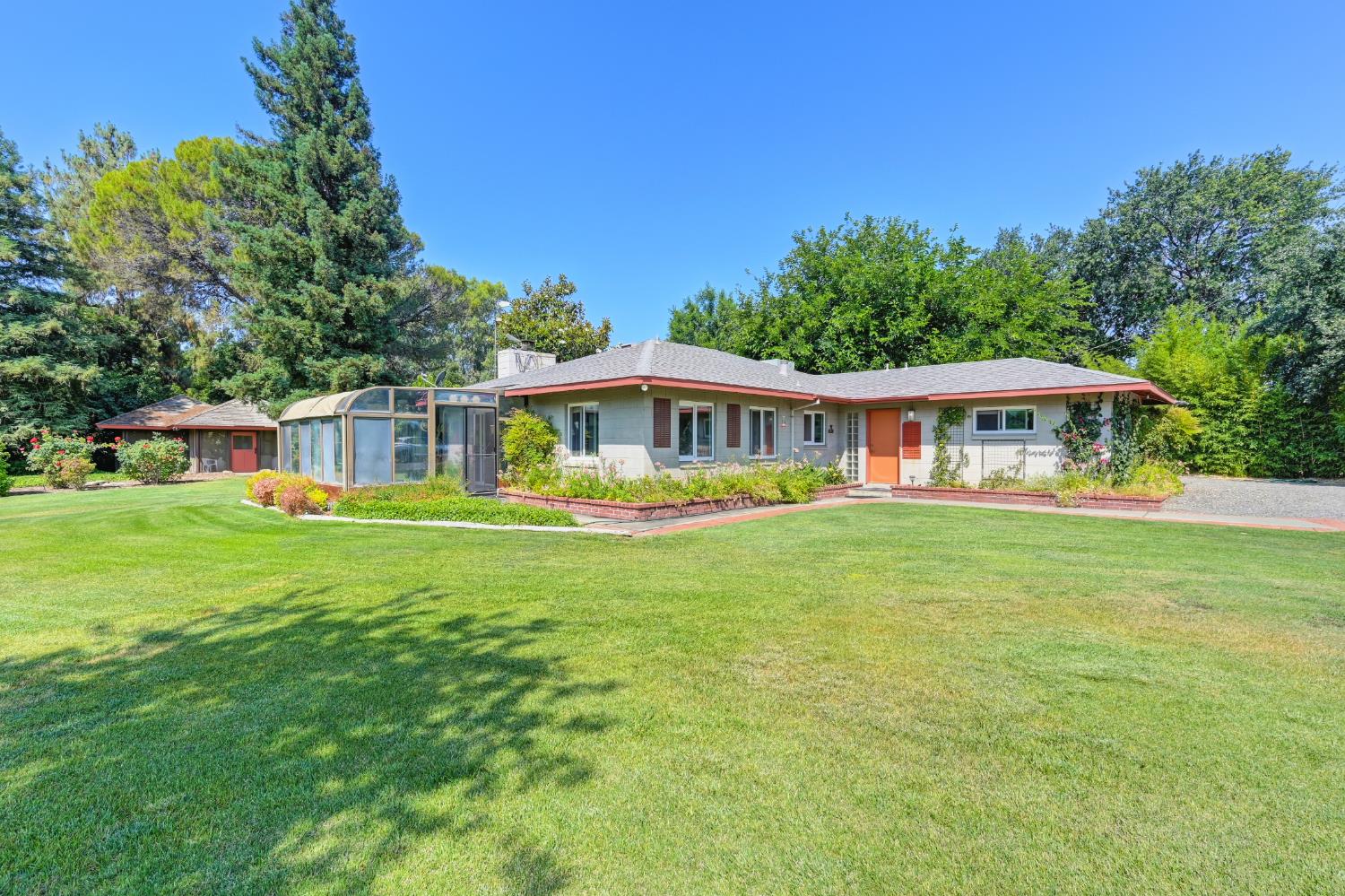 26738 County Road 98 Davis, CA 95616 - Photo 1 of 1 a front view of a house with a garden