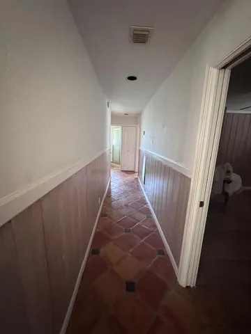 a view of a hallway with a stairs