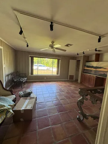 a room with gym equipment and a window