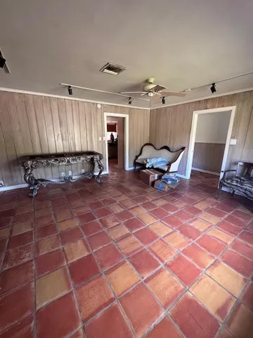 a view of a chairs and table in the room