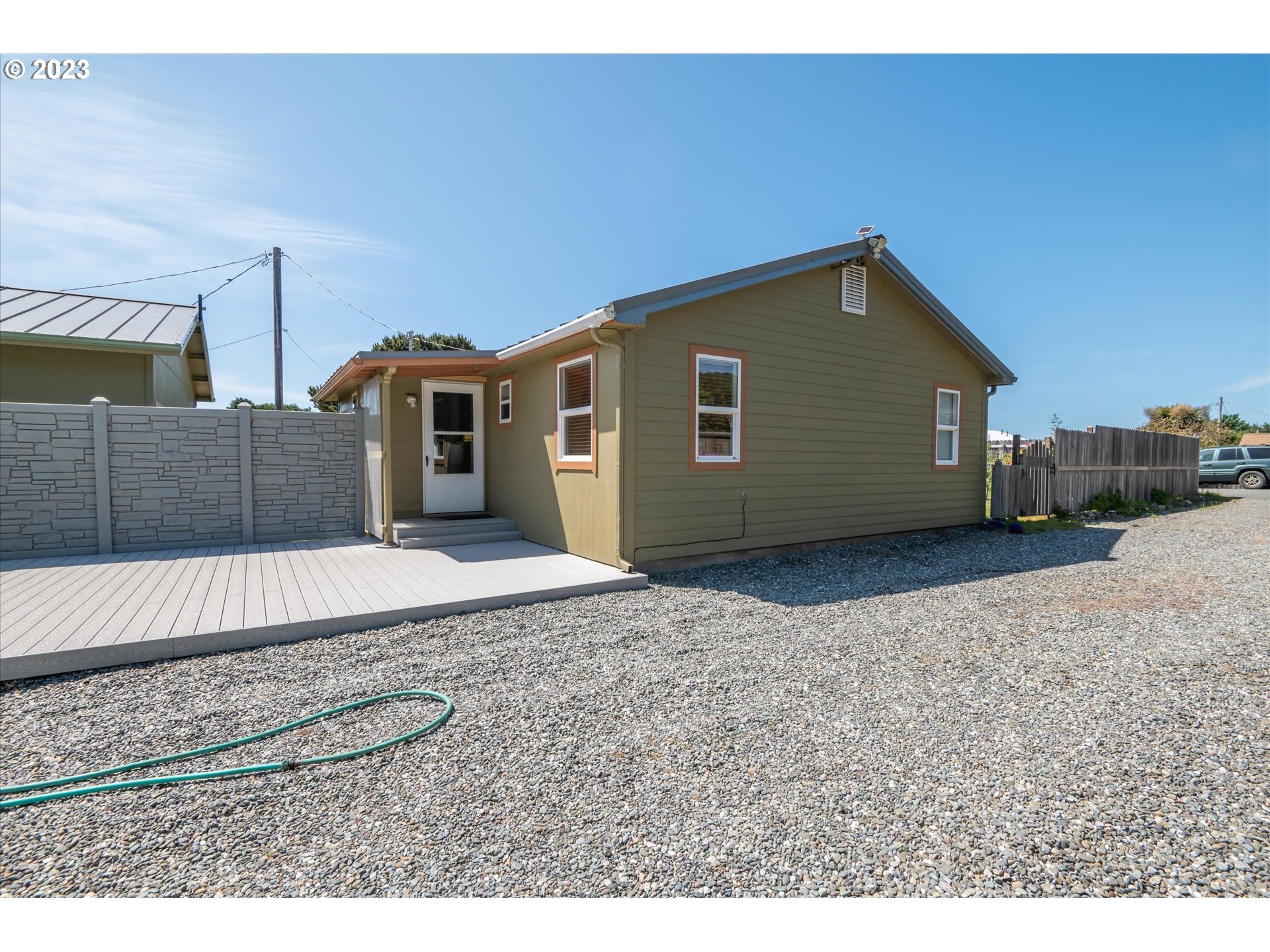 94572 Chandler Road Gold Beach, OR 97444 - Photo 14 of 48 a house view with a backyard