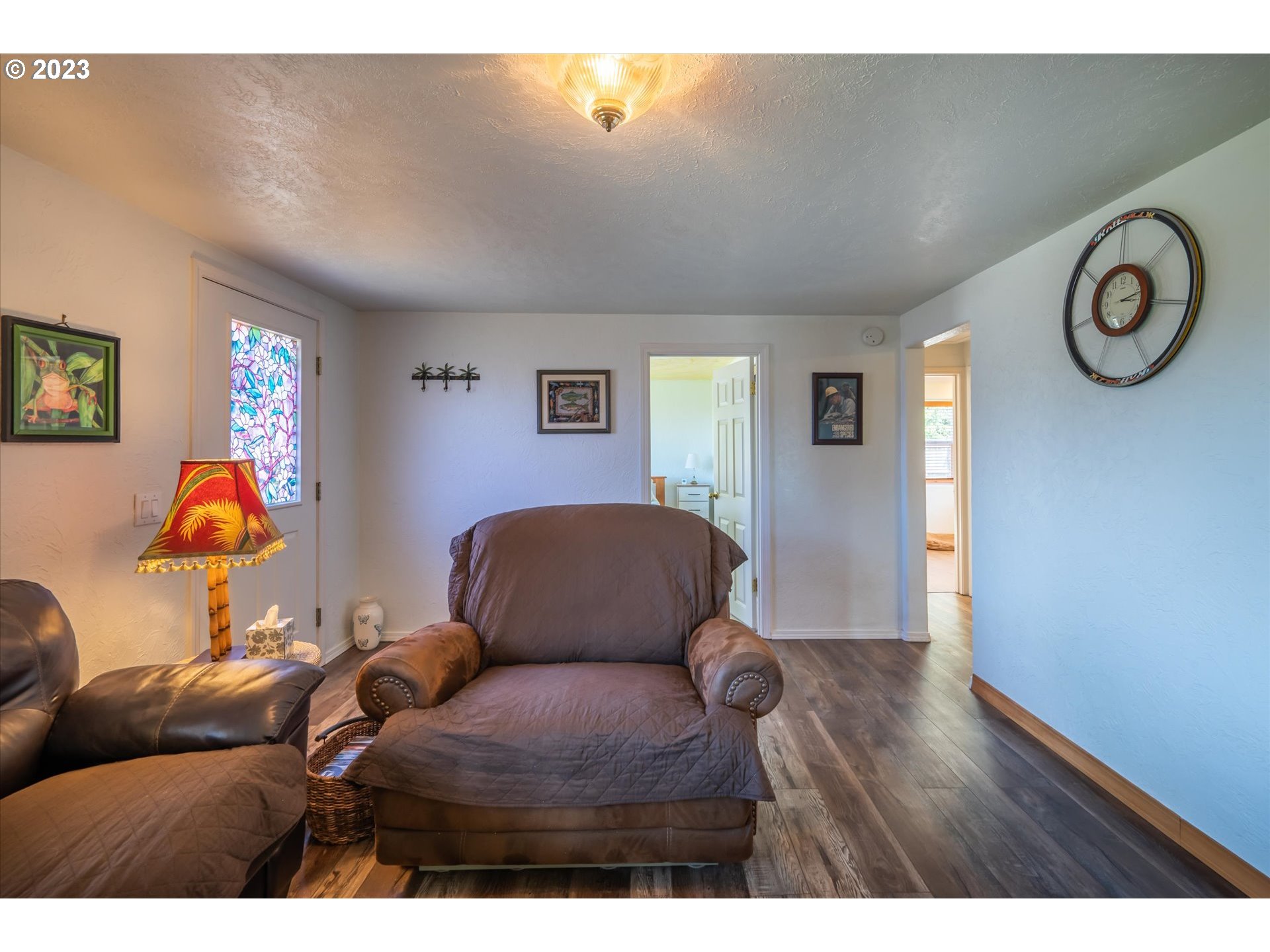 94572 Chandler Road Gold Beach, OR 97444 - Photo 17 of 48 a bedroom with furniture and a window