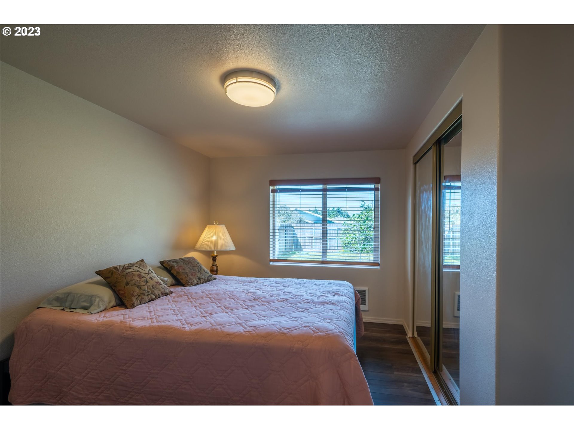 94572 Chandler Road Gold Beach, OR 97444 - Photo 28 of 48 a bedroom with a bed and window