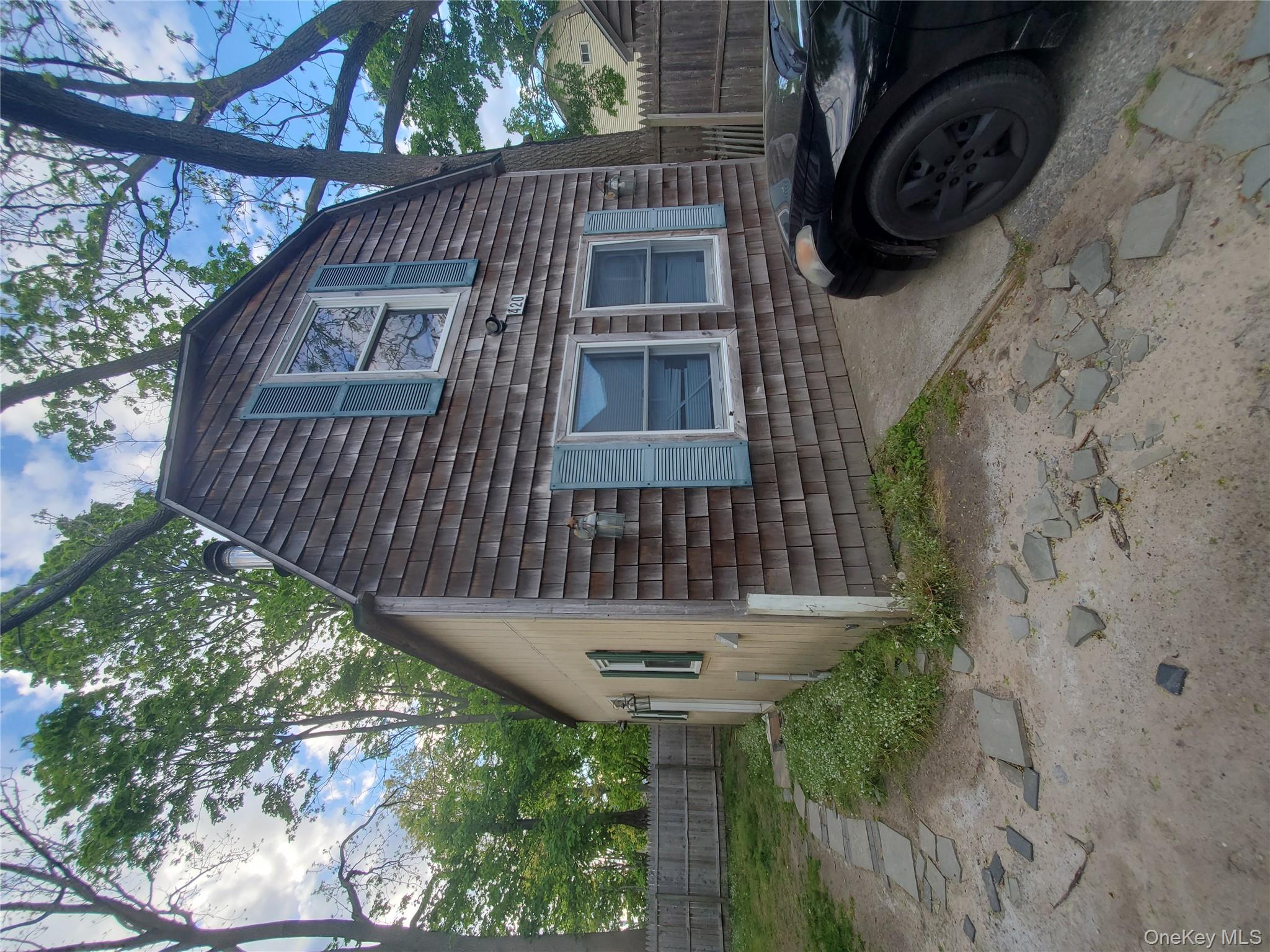 418 Lincoln Street Riverhead, NY 11901 - Photo 7 of 11 a view of a car parked front of a house