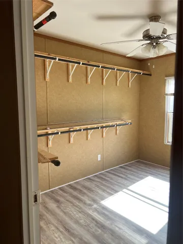 a bathroom with a shower and a sink