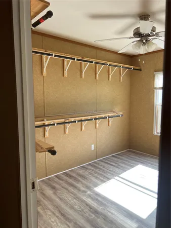 a bathroom with a shower and a sink