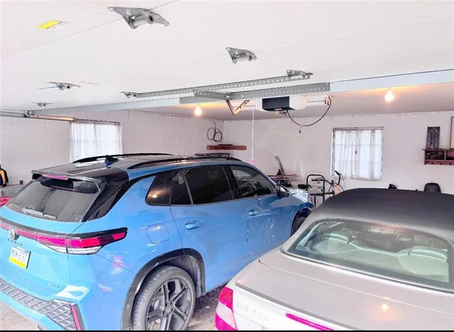 a view of gym equipment and kitchen area