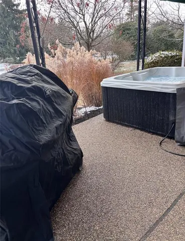 a bedroom with a bed and a potted plant