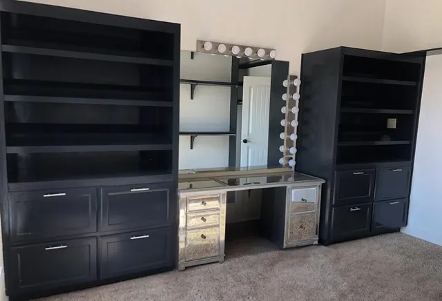 a kitchen with stainless steel appliances granite countertop a refrigerator and a stove