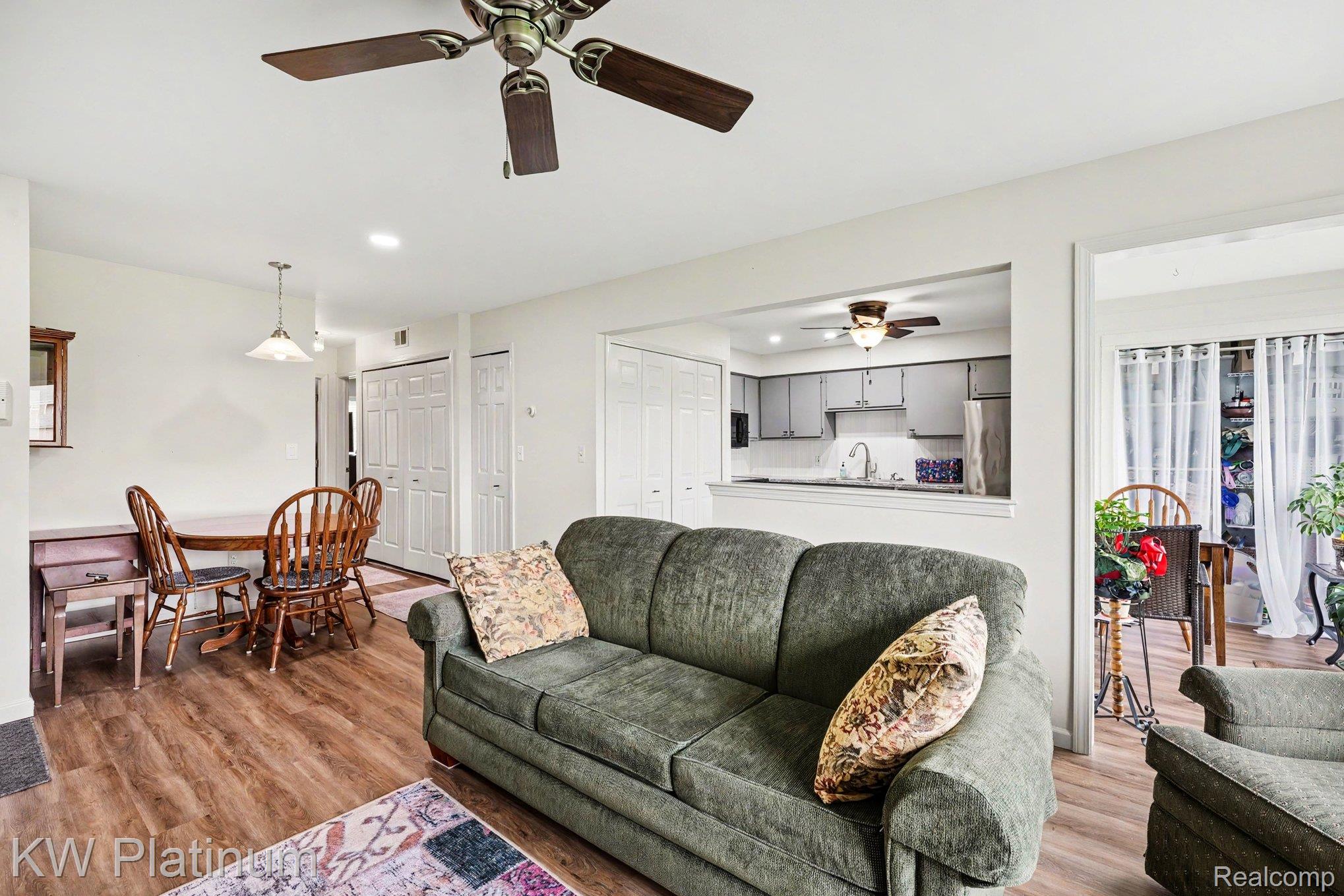 1700 River Road, Unit 6 Marysville, MI 48040 - Photo 8 of 32 Living area featuring wood-finish flooring, recessed lighting, and a ceiling fan