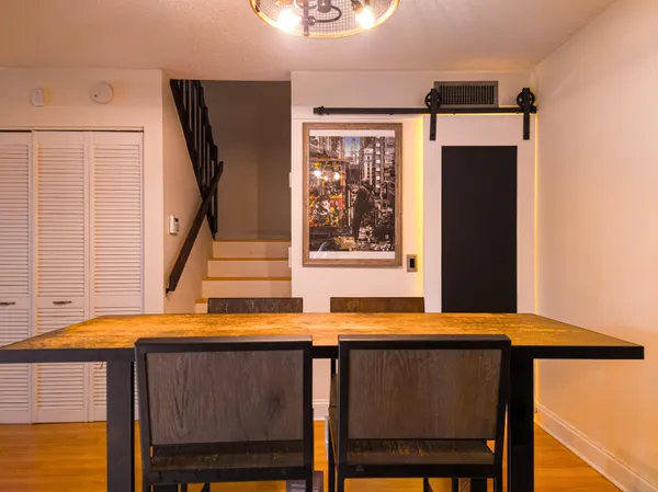 a view of balcony with furniture and a window