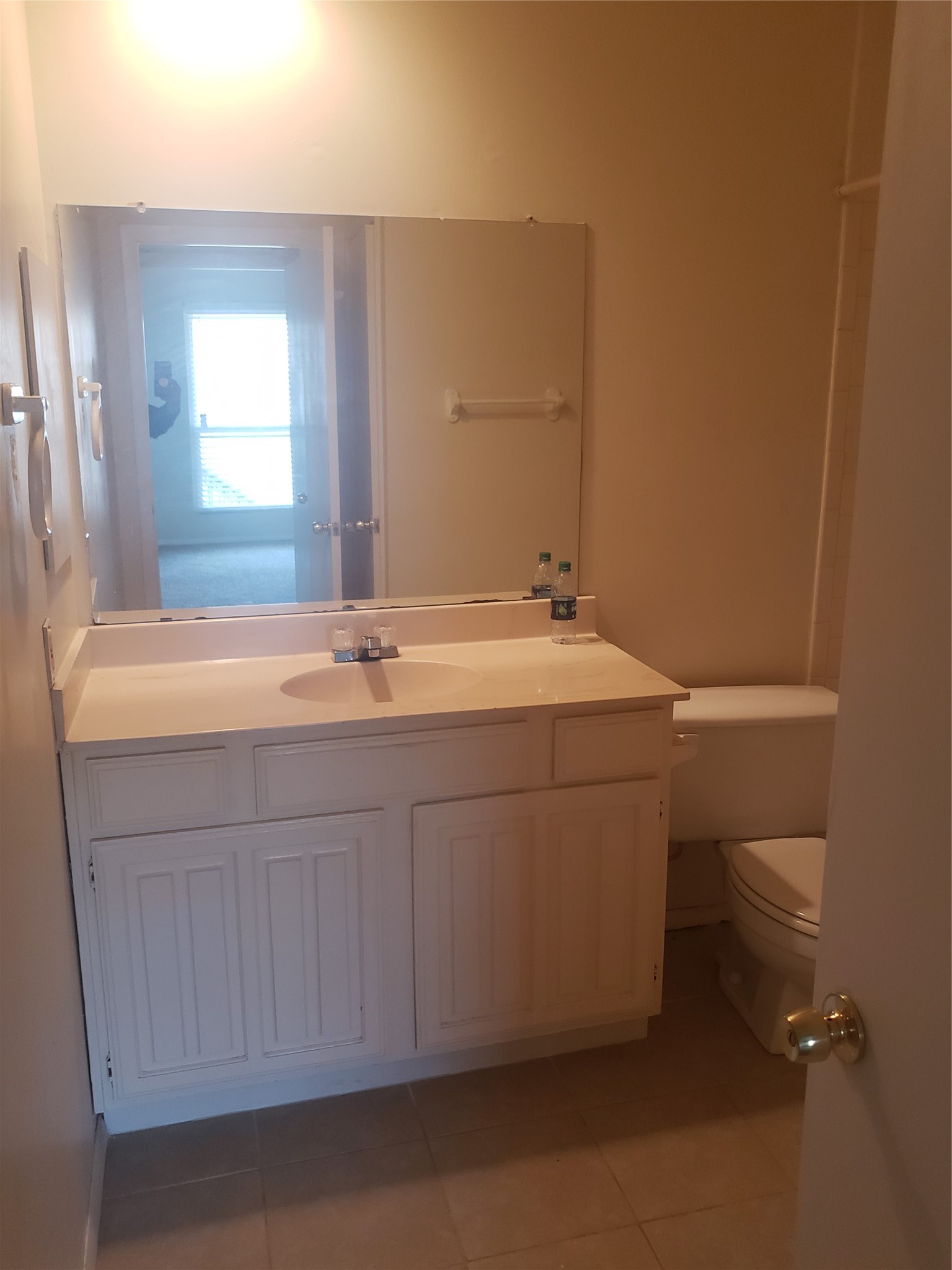 16120 Stuebner Airline Road, Unit 603 Spring, TX 77379 - Photo 15 of 19 a bathroom with a sink a toilet and mirror