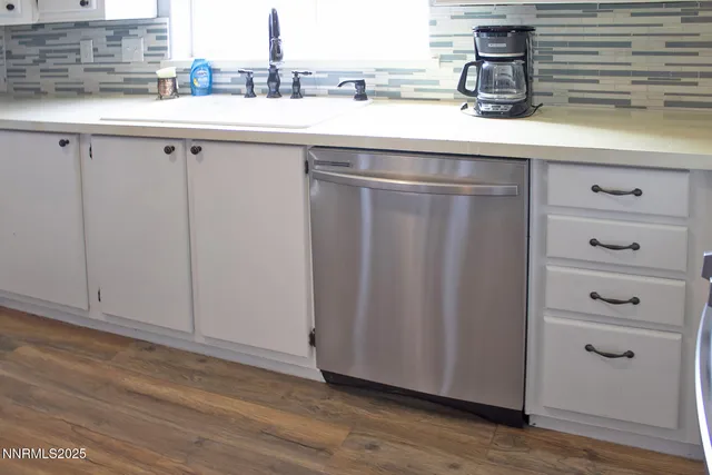 a kitchen with a sink and cabinets