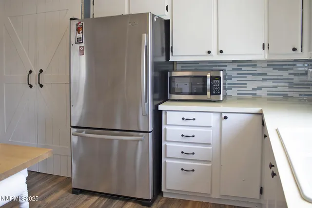a kitchen with appliances and cabinets