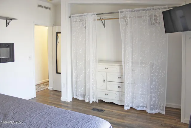 a view of a bathroom with wooden floor