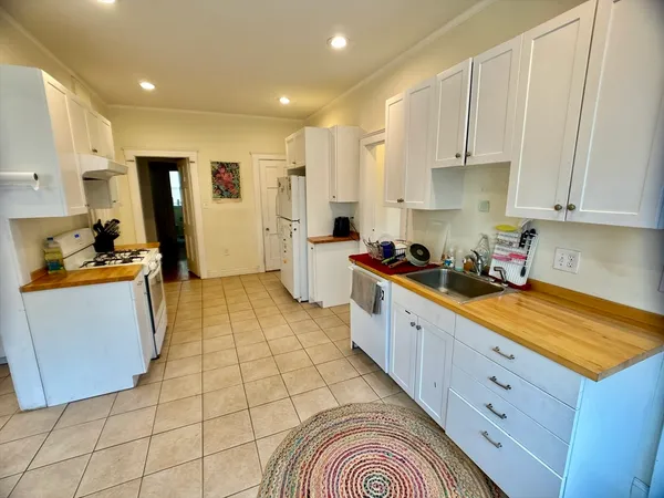 a kitchen with stainless steel appliances granite countertop a sink and cabinets