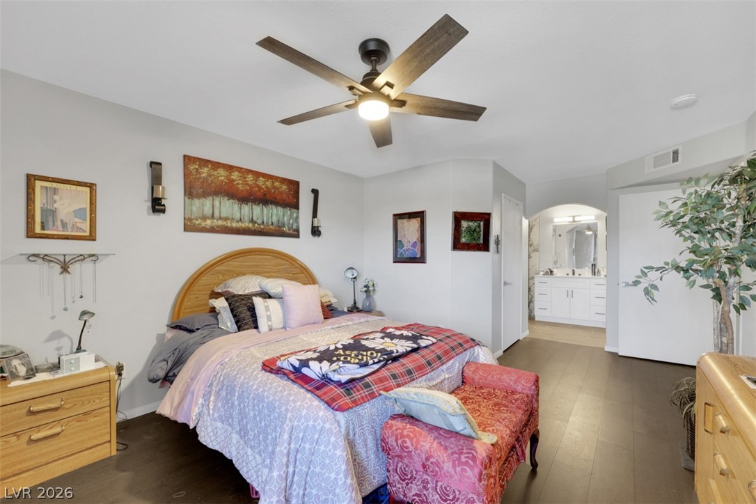 698 South Racetrack Road, Unit 1614 Henderson, NV 89015 - Photo 21 of 35 Comfortable living space with dark flooring flows seamlessly into an en-suite bathroom.