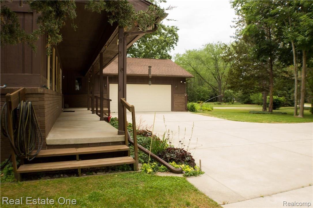 8911 River Valley Road Brighton, MI 48116 - Photo 2 of 34 FRONT PORCH SIDE VIEW