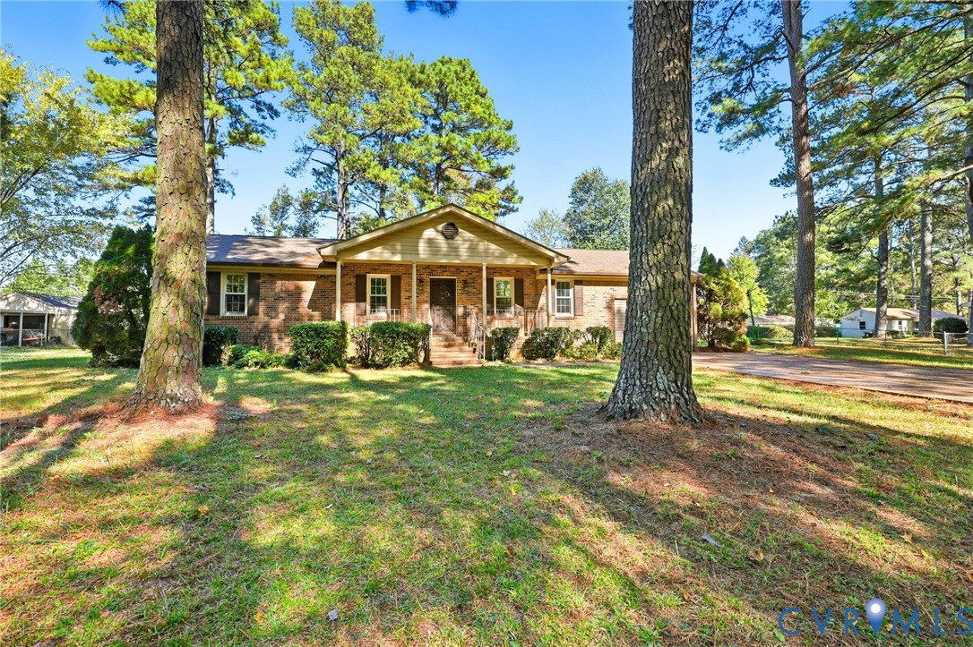 2521 Fort Lee Road Petersburg, VA 23805 - Photo 2 of 27 a front view of a house with garden