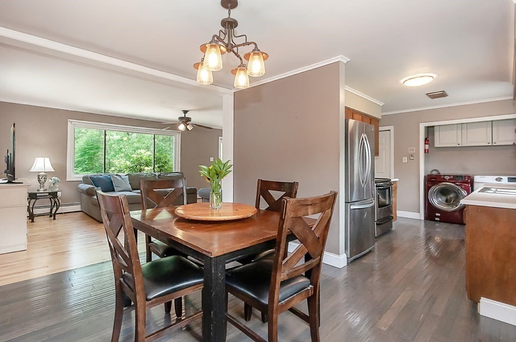68 Bullock Road Freetown, MA 02717 - Photo 12 of 32 a view of a dining room with furniture window and wooden floor