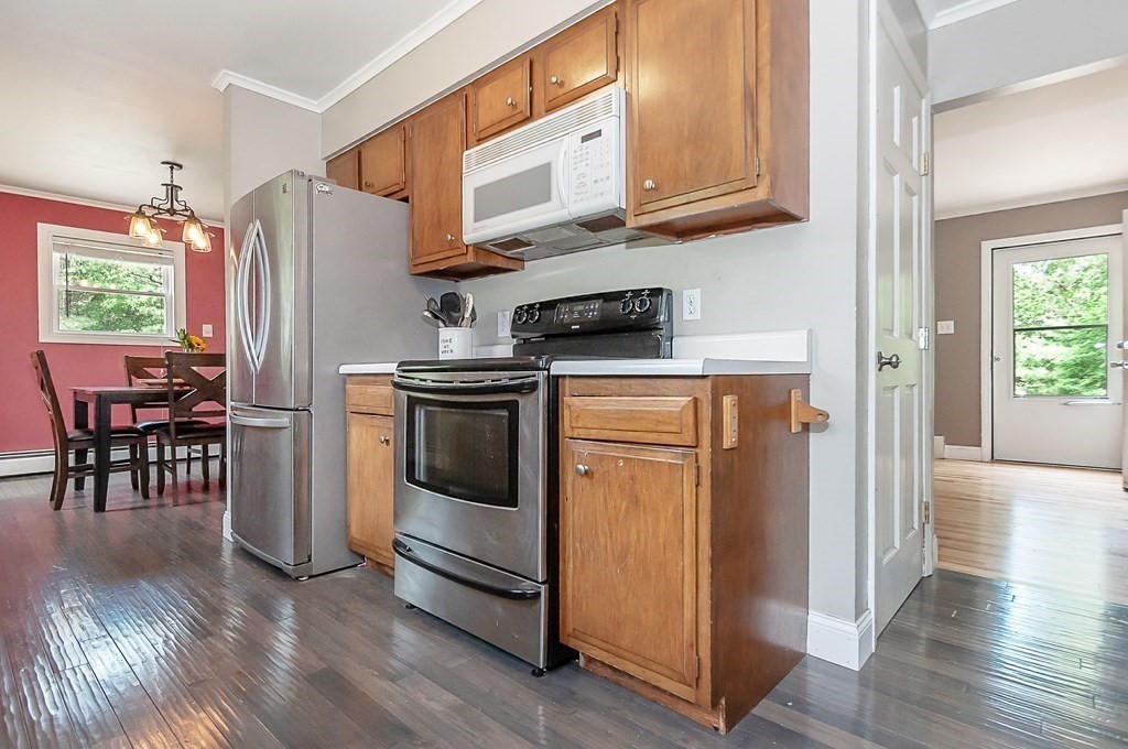 68 Bullock Road Freetown, MA 02717 - Photo 13 of 32 a kitchen with stainless steel appliances granite countertop a refrigerator sink and stove