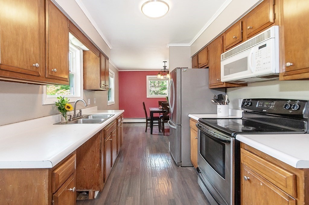 68 Bullock Road Freetown, MA 02717 - Photo 14 of 32 a kitchen with stainless steel appliances granite countertop a stove a sink and a refrigerator