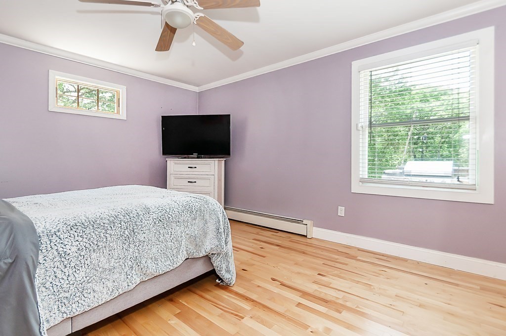 68 Bullock Road Freetown, MA 02717 - Photo 15 of 32 a bedroom with a bed and a flat screen tv