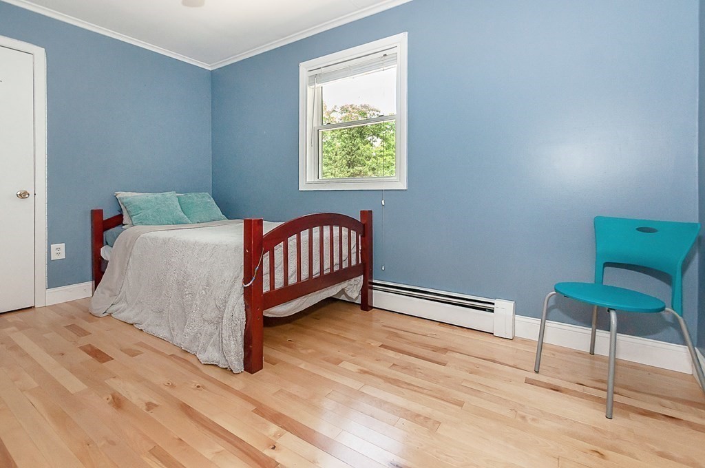 68 Bullock Road Freetown, MA 02717 - Photo 17 of 32 a bedroom with a bed and a chair