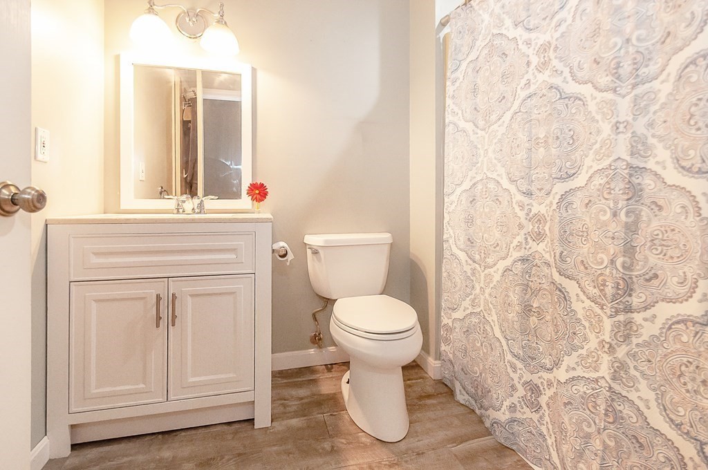 68 Bullock Road Freetown, MA 02717 - Photo 18 of 32 a bathroom with a toilet sink and vanity