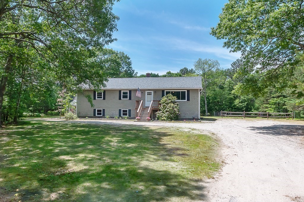 68 Bullock Road Freetown, MA 02717 - Photo 2 of 32 a front view of a house with a garden