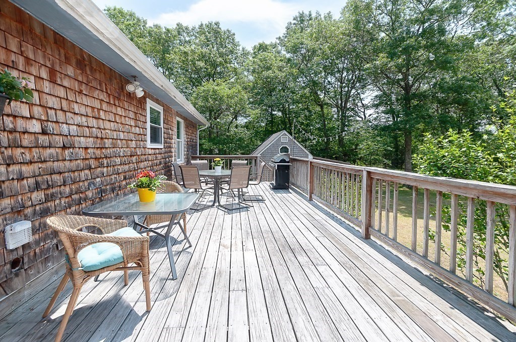 68 Bullock Road Freetown, MA 02717 - Photo 22 of 32 a view of deck with wooden floor and outdoor seating
